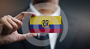 Businessman Holding Card of Ecuador Flag