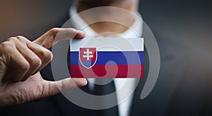 Businessman Holding Card of Slovakia Flag