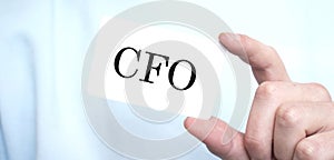 Businessman holding a card with text CFO ,business concept
