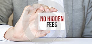 Businessman holding a card with text NO HIDDEN FEES