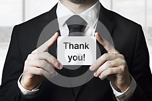 Businessman holding card thank you