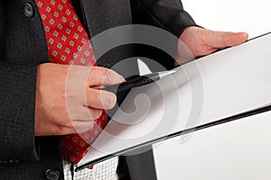 Businessman holding clipboard