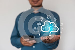 Businessman holding a cloud data icon with light. Computing data on network. Insurance Business computer security concept