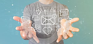 Businessman holding a cloud of social media network icon