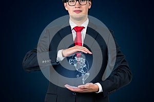 Businessman holding continent Americaon