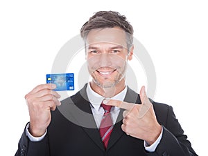 Businessman holding credit card