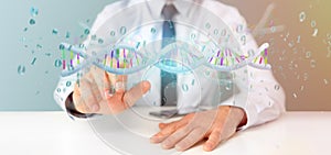 Businessman holding a 3d rendering data coded Dna with binary file around