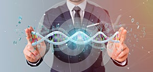 Businessman holding a 3d rendering data coded Dna with binary file around