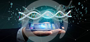 Businessman holding a 3d rendering data coded Dna with binary file around