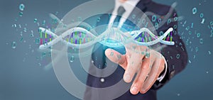 Businessman holding a 3d rendering data coded Dna with binary file around