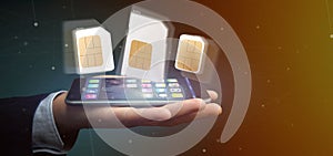 Businessman holding Different size of a smartphone sim card 3d r