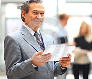 Businessman holding digital tablet