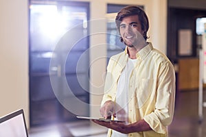 Businessman holding digital tablet in office