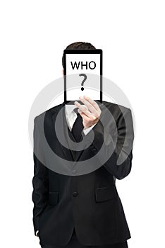 Businessman holding a digital tablet up over his face. Business