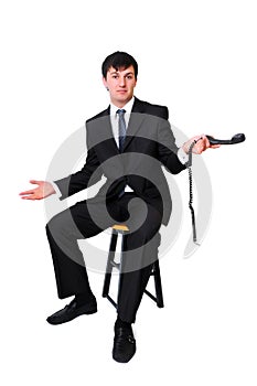 Businessman holding disconnected phone receiver photo