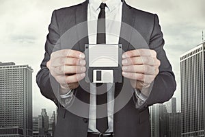 Businessman holding diskette in hands