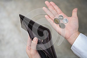 Businessman holding an empty wallet. He was facing a stressful crisis. He is waiting for a new job, recession situation,