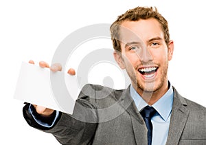 Businessman holding empty white placard showing copy space