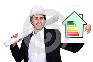 Businessman holding energy consumption label