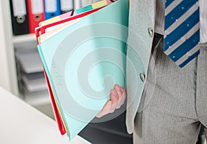 Businessman holding files