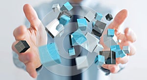 Businessman holding floating blue shiny cube network 3D rendering