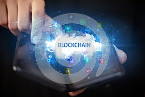 Businessman holding a foldable smartphone, technology concept