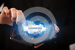 Businessman holding a foldable smartphone, technology concept