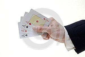 Businessman holding four aces