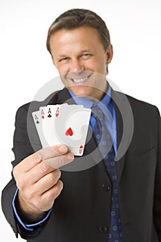 Businessman Holding Four Aces