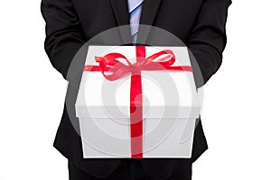 Businessman holding gift box