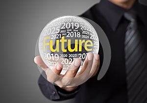 Businessman holding a glass ball