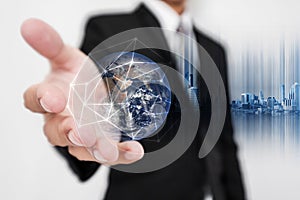 Businessman holding globe hologram with network connection lines. Global business networking, currency exchange and travel around