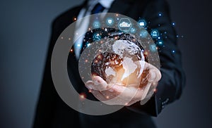businessman holding globe with virtual Global Internet connection. global internet connection application technology and digital