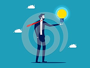 Businessman holding a glowing light bulb. knowledge and creativity. business concept