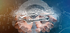 Businessman holding a graphene structure - 3d rendering