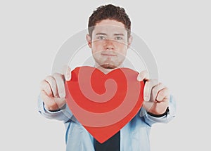 Businessman holding a heart shape