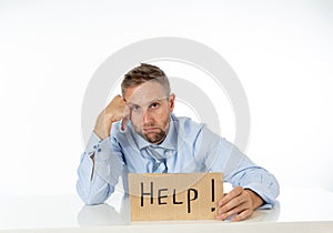 Businessman holding help sign message