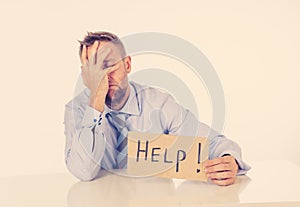 Businessman holding help sign message