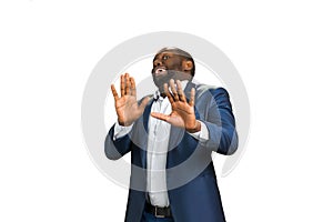 Businessman holding his hands outstretched.