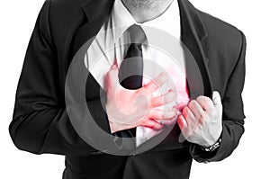 Businessman holding his heart in pain