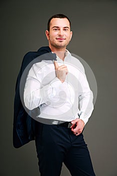 Businessman holding his jacket over shoulder