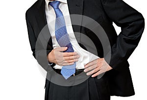 Businessman holding his stomach in pain with stomachache or indigestion photo