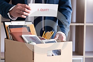 Businessman holding with I quit words card letter, resign employee Change of job concept