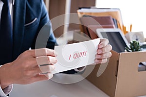 Businessman holding with I quit words card letter, resign employee Change of job concept