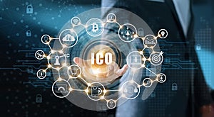 Businessman holding icon with ICO or Initial Coin Offering photo