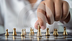 Businessman holding a king on a chess board to move forward and start the game represents Strategic planning and business planning