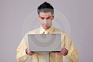 Businessman holding laptop