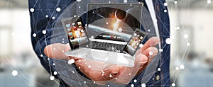 Businessman holding laptop phone and tablet in his hand 3D rendering