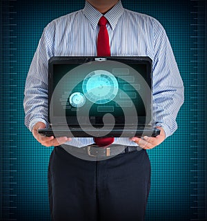 Businessman holding a laptop showing business graph