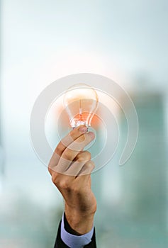 Businessman holding light bulb. Brain creative thinking ideas and innovation concept